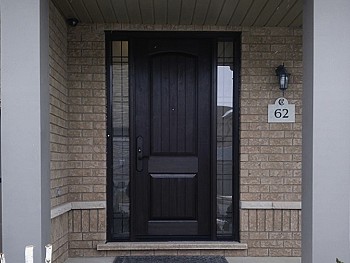 Dark Brew fiberglass door with two wrought iron sidelites