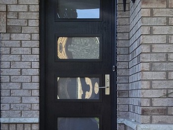 Dark fiberglass door with Quadruple inserts exterior view