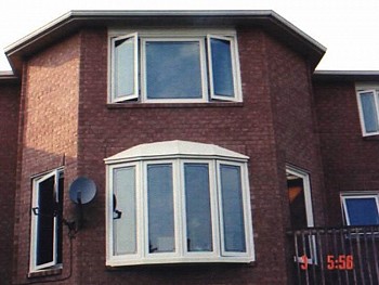 white exterior bow window and casement window Caledon